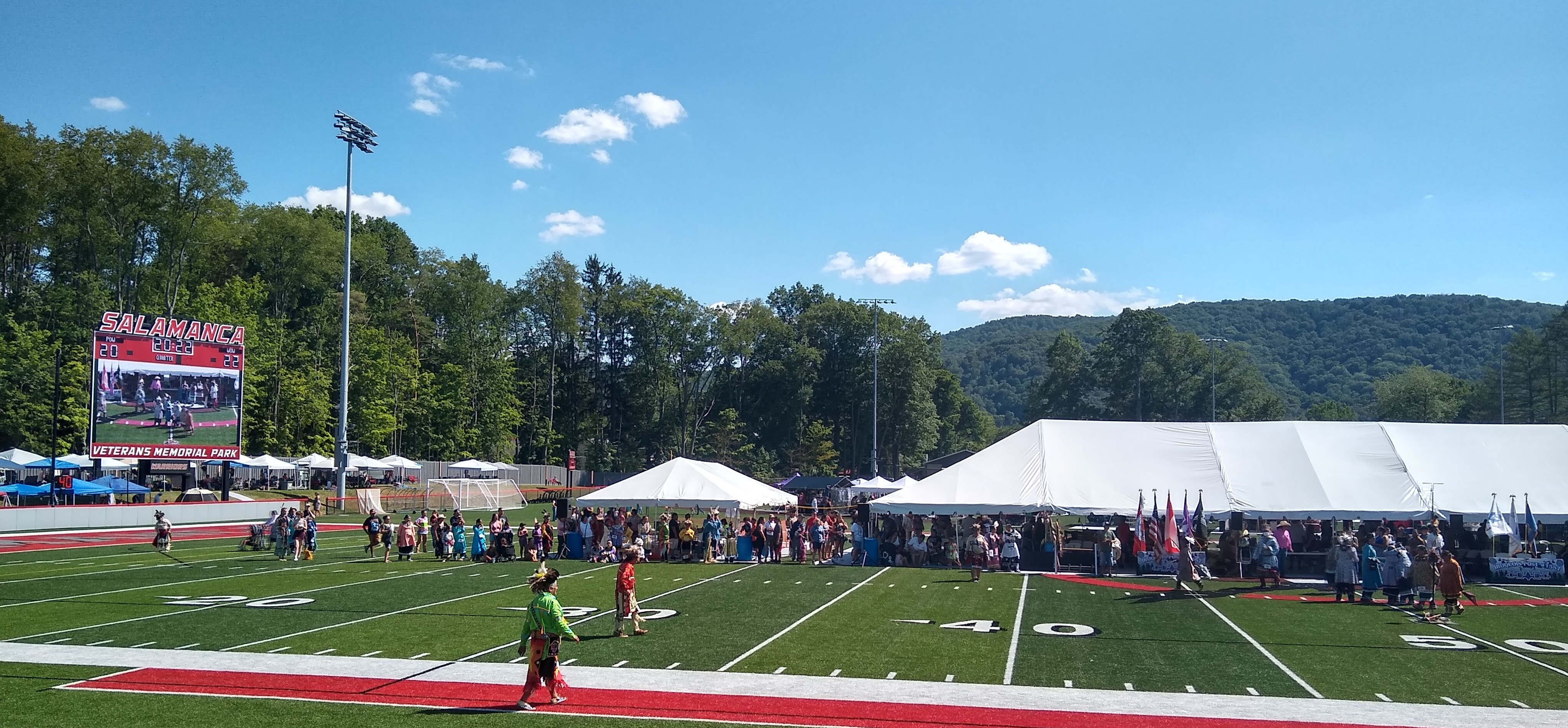 Bill Crouse (in green) prepares to compete in the Marvin “Joe” Curry Memorial Veterans Pow-Wow on the Allegany Territory of the Seneca Nation of Indians (photograph by Andrew Cashner, Salamanca, NY, July 2022)